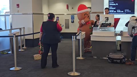 Gingerbread Man Spreads Christmas Cheer In The Airport
