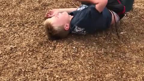 Kid in black shirt tries to do flip and falls