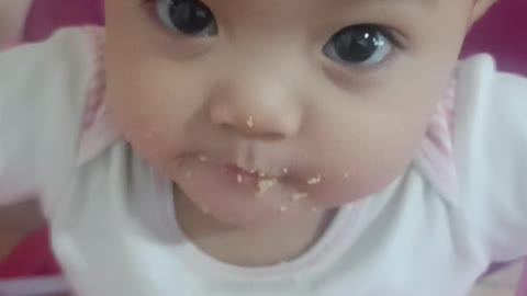 Little cute baby while eating flakes