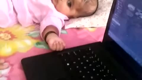 Sarah playing with laptop