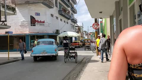 Walking to see local Barbershop in Holguin City Cuba 10 12 2019