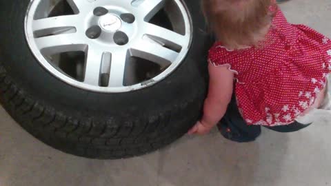 Baby Tries Helping Daddy Fix The Car