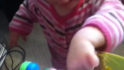 Emma playing baby