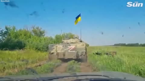 Ukrainian troops capture and fly flag from Russian Z tank