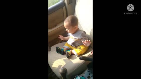 Cute Baby driving a Car