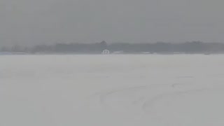 Wind Blows Ice Fishing Shanty Across Lake