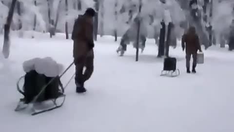 Winter. Soldiers with sledges.