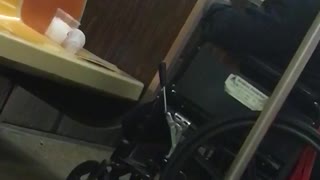 Man in wheelchair smokes cigarette inside subway