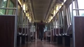 Guy slides to camera on wood floor train