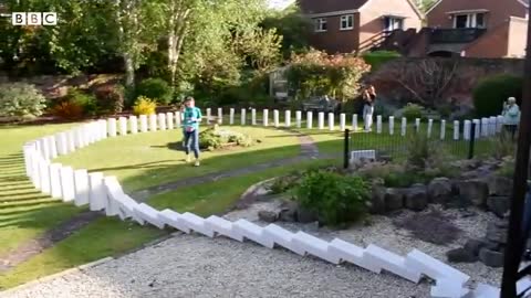 Giant concrete dominoes fall to start UK festival