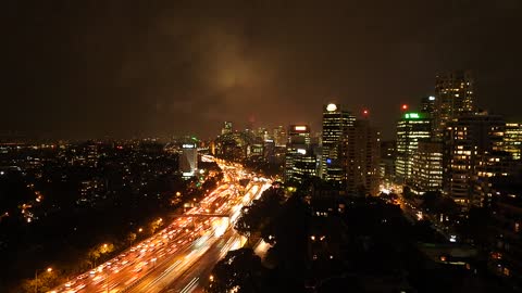 The night glow in the city in timelapse.