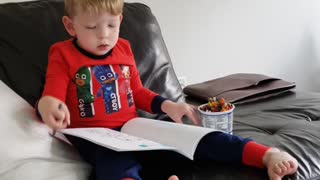 Wee man coloring on a Sunday