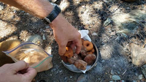 Making donuts at camp in a Stanley cook pot!