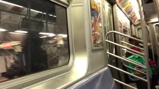 Woman sings loudly in subway train, recorder laughs