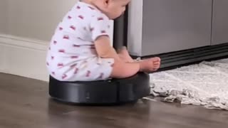 Little Guy Takes Roomba for A Ride