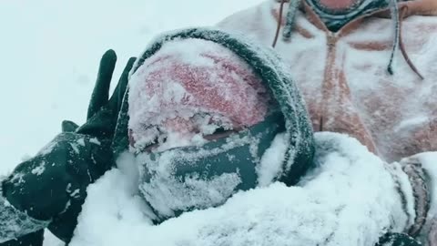 Tandem Sled Frosts Lashes In Snow