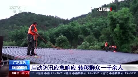 Driver abseils to safety in China's raging floodwaters