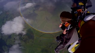 Skydivers Soar Above 360 Degree Double Rainbow