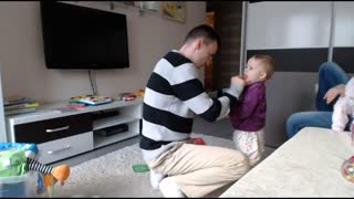 Baby maliciously bites daddy's finger, finds it hilarious