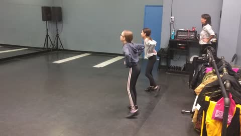Macey and Sophie tap dancing