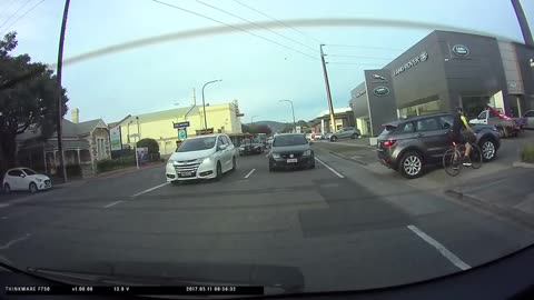 Bicyclist Almost Gets Hit and Spits on Car