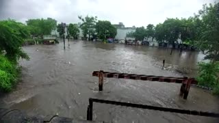 Rescuers save people in flooded western India