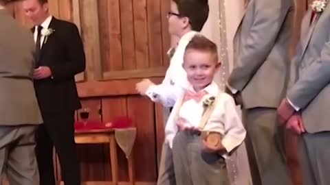 kid adds comedy to a wedding!