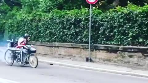 Small motorcycle misses turn and runs into fence gate