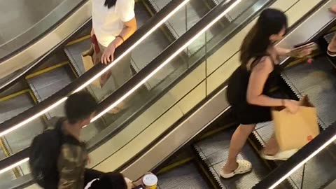 Distracted Person Doesn't Realize Escalator Is Stopped
