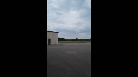Father Teaches Son How To Fly A Model Airplane
