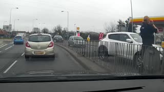 Insane video of car backing into fallen police officer