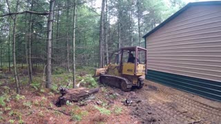 Case 450 Dozer grading around a newly built metal pole barn