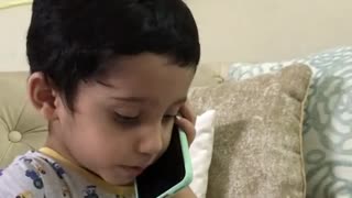 Sweet Toddler Speaks Baby Talk While Pretending To Have Phone Conversation
