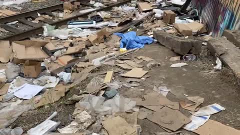 Video shows thousands of empty and damaged packages lined around the tracks of a Los Angeles railway