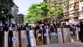 Protesters practice shield formation before clashes