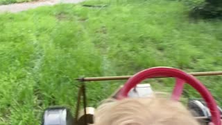 Boy Takes Dad for a Tour in Miniature Model T