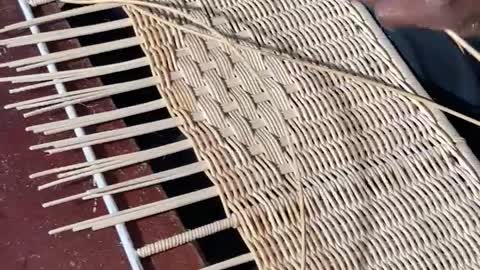 Rattan weaving on panels.