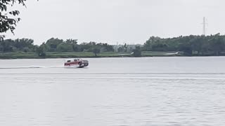 Pickup Truck Vessel Cruises Across Lake