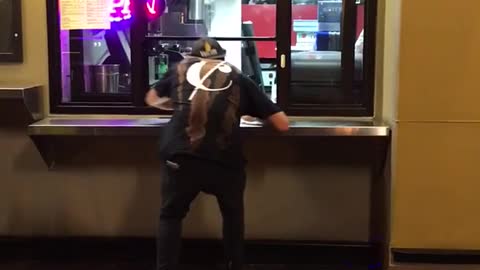 Guy steals entire pack of gatorade from pizza window