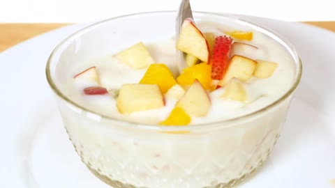 Bowl with yogurt served with chopped fruit