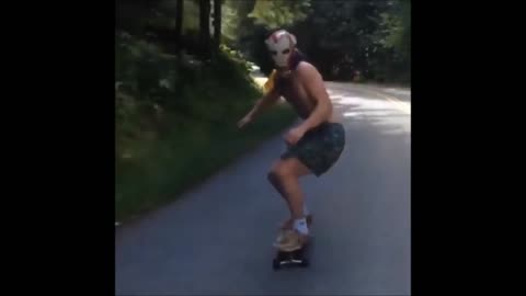 Dude skateboarding with Iron Man mask wipes out hard