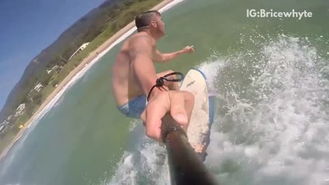 Slot motion blue shorts man surfs with selfie stick