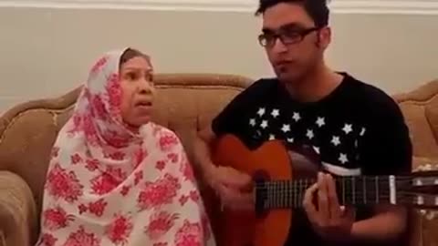 Mother and her son singing a traditional song