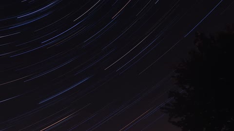 Bright star trails across the night sky