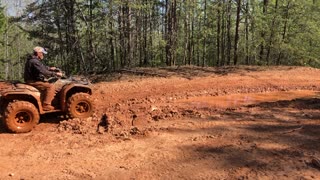 Yamaha plowing through long mud hole