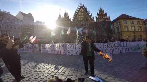Burned photo of Angela Merkel Polish anti-immigrant demonstration April 2nd 2016