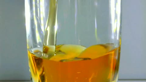 Slo-mo Pouring Super Chilled Liqueur into Shot Glass with Smooth Effect