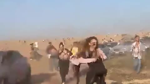 Israeli rave goers run for their lives when Hamas paraglide in and start shooting...