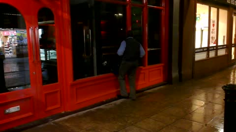 Talented but shy drunk guy singing into an empty shop in London