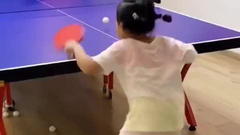 girlshis mother's coach are good at playing ping pong
